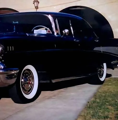 Black 1957 Chevrolet Bel Air with chrome and whitewalls